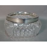 Silver and silver mounted wares, comprising; a faceted glass salad bowl, having a silver rim,