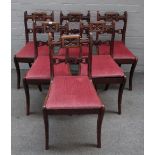A set of six late Regency yew wood dining chairs,