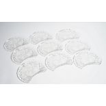 Lalique; a set of eleven glass crescent shaped `thistle' salad plates, mid 20th century,