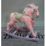 'Thoroughbred Horses', a modern pink upholstered child's rocking horse, 103cm wide x 84cm high.