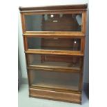 The Globe Wernicke Co Ltd; an oak four tier glass fronted bookcase, 87cm wide x 148cm high.