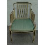 A George III green painted and ebonised armchair,
