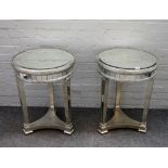 A pair of modern mirror veneered circular occasional tables, on tapering square supports,