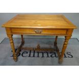 A 19th century Continental fruitwood single drawer side table, on turned supports,