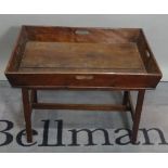 An early 20th century mahogany occasional table with tray top and twin handles,