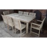 A teak rectangular garden table, 97cm wide x 203cm long, together with eight matching chairs,