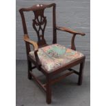 A George III mahogany open arm carver chair with pierced splat on block supports,