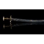 An early 19th century Indian gold inlaid Tulwar sword, with curved Damascened blade,