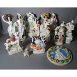 A group of nine 19th century and later Staffordshire Flatback Figures, the tallest 35cm high,