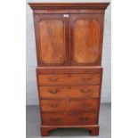 A small George III mahogany linen press, the pair of doors over four long graduated drawers,