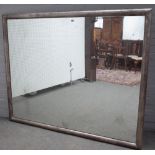 A large 20th century rectangular mirror, in silvered frame, 176cm wide x 144cm high.