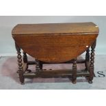 A 17th century style oak drop flap gateleg table, on floral carved supports, 108cm wide x 74cm high.