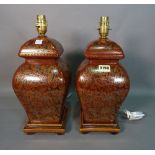 A pair of modern brown glaze baluster table lamps, with foliate decoration, 37cm high, (2).