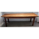 A 19th century oak kitchen table, with cleated twin plank top on canted square supports,