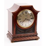 An Edwardian mahogany 8-day mantel clock.
