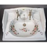 SANITAN, a modern galleried ceramic sink with floral decoration, 63cm wide x 10cm high.