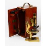 'Ross London',a late 19th century brass monocular microscope with rack and pinion focussing,