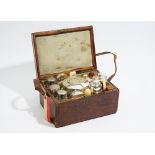 A Victorian leather cased travelling tea set, comprising; two silver spoons,