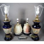 A pair of modern onyx table lamps, 32cm high, a pair of Doulton style lamps, 50cm high,