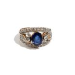 A gold, sapphire and diamond ring, in a tapered panel shaped design,