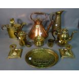 A quantity of copper and brassware, including kettles, jugs, a pair of candelsticks, trays,