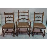 A set of three Charles II style oak ladder back dining chairs, to include a carver,