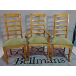 A set of eight modern stained beech ladderback dining chairs, to include two carvers,