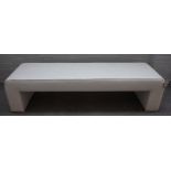 A large 20th century 'U' shaped grey upholstered footstool, 173cm long x 43cm high.