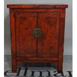 A modern black lacquer and red painted Chinese side cupboard, 65cm wide x 80cm high.