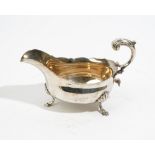 An early George III silver sauce boat, having a scroll handle,