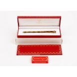 A Must de Cartier gold plated fountain pen, cased, with guarantee card and booklet.