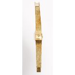 An Omega lady's gold square cased wrist watch, with a signed, jewelled automatic circular movement,