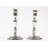 A pair of late Victorian silver table candlesticks,