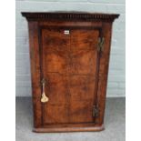 A George III oak and pollard oak wall hanging corner cabinet,