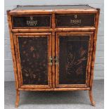 A Victorian bamboo and lacquer side cabinet, with pair of drawers over cupboards,