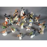 Eighteen Goebel ceramic bird figurines.