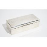 A rectangular hinge lidded table cigarette box, the lid engraved with seven facsimile signatures,