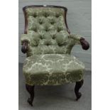 A Victorian carved mahogany framed slipper back open armchair, with scroll arms and supports,