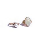 A gold ring, claw set with an oval opal, apparently unmarked, ring size I and a gold ring,