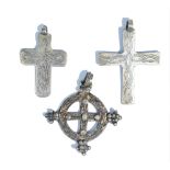 Three Coptic pendant crosses, the first of circular form,