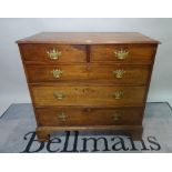 A George III mahogany chest, of two short and three long drawers on bracket feet,