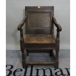 An 18th century and later oak open armchair, 53cm wide x 90cm high.