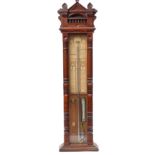 An Admiral Fitzroy barometer, in a carved oak case, 122cm high.