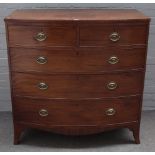 A Regency mahogany bowfront chest, of four long graduated drawers on splayed bracket feet,