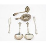 Silver, comprising; a pair of spoons, having circular bowls and with cast decoration to the handles,