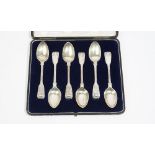 A set of six Victorian silver double struck, fiddle, thread and shell pattern dessert spoons,