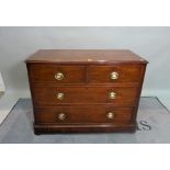 A late Victorian mahogany chest, of two short and two long drawers on bun feet,
