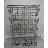 An early 20th century wrought iron fourteen tier wine rack, 103cm wide x 164cm high.