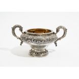 A Victorian silver twin handled sugar bowl, of squat circular form,