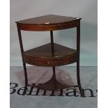 A Regency mahogany corner washstand, on outswept supports, 63cm wide x 86cm high.